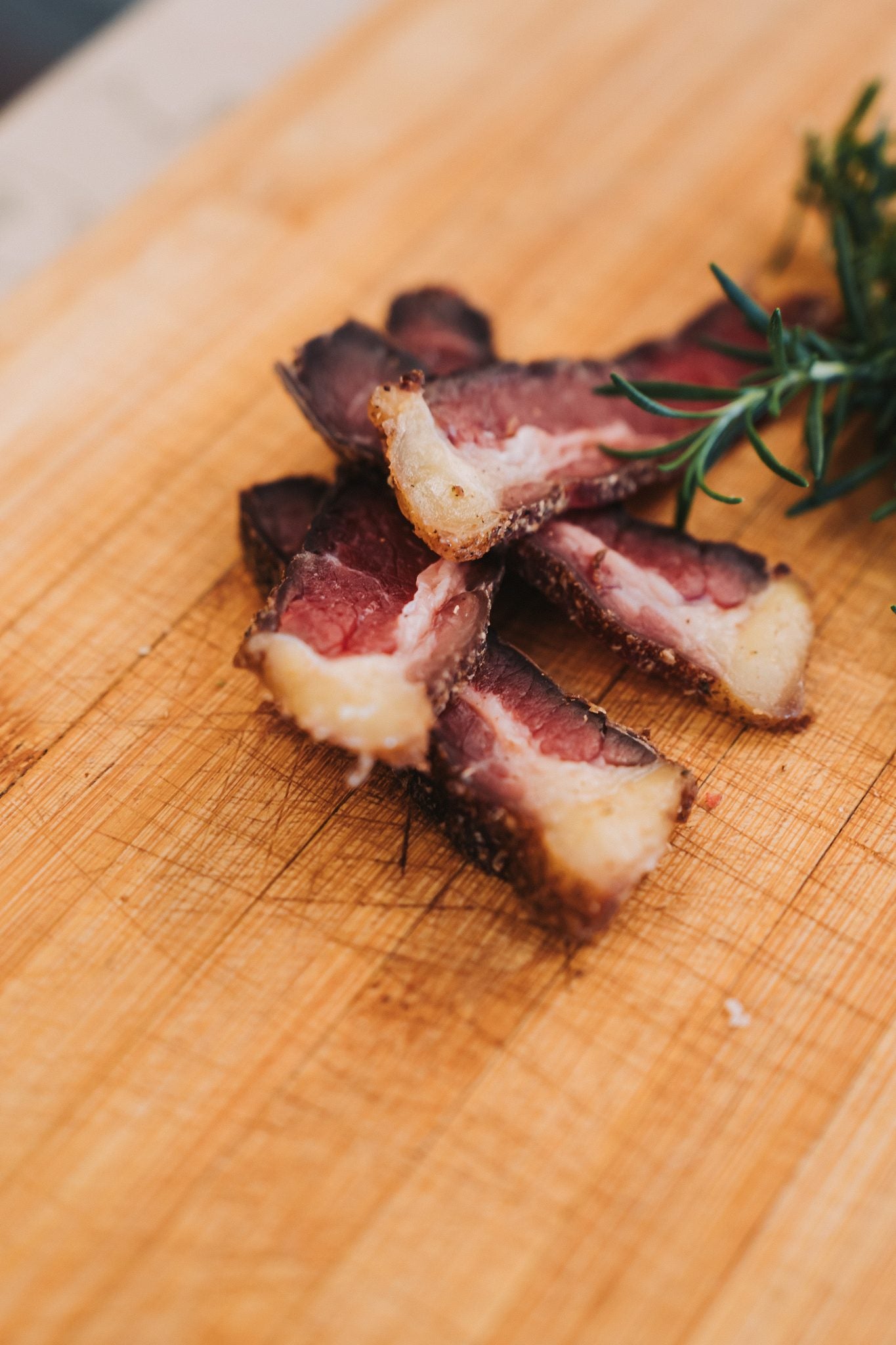 Sliced BULL biltong showing the golden yellow fat